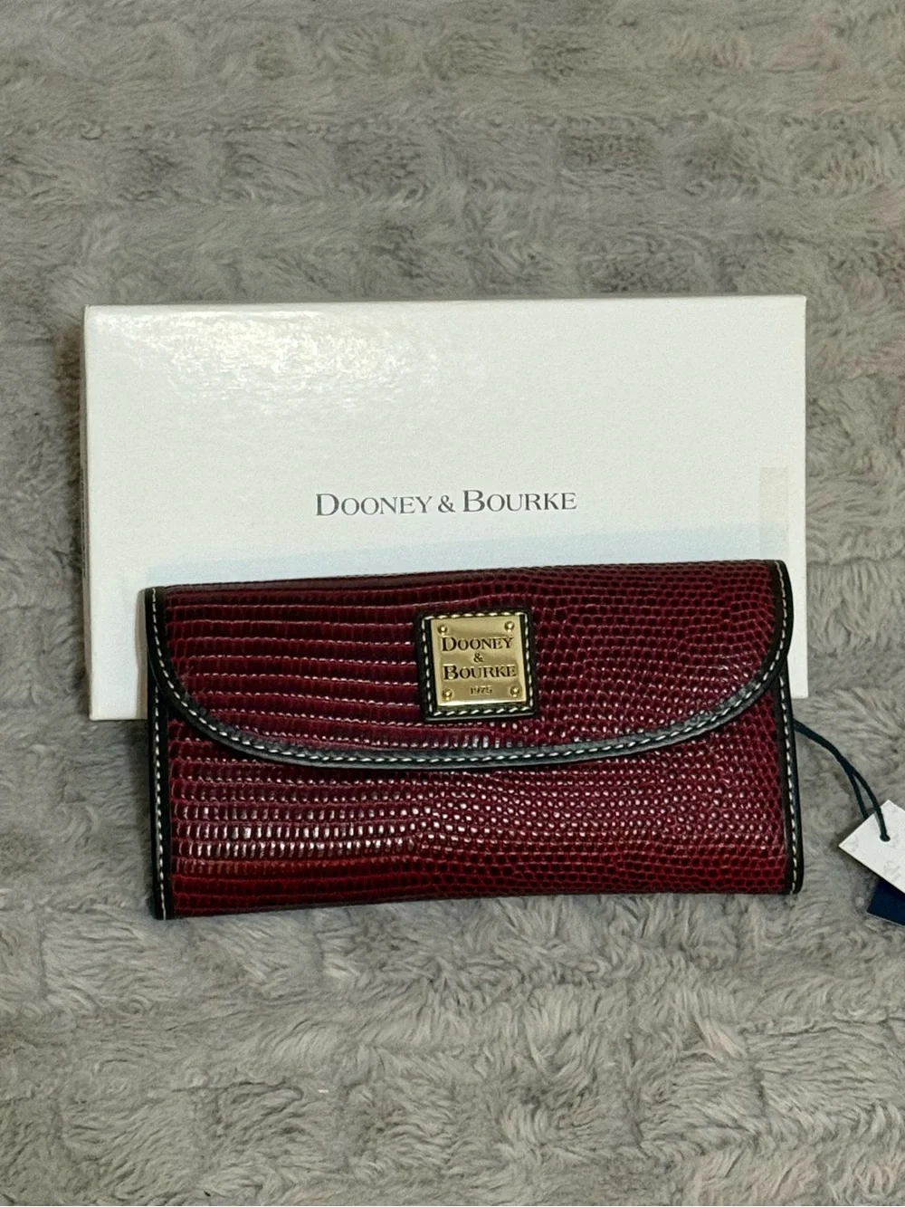 Dooney & Bourke Burgundy Textured Clutch Wallet with Gold Plaque
